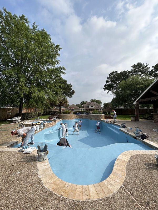 Express Pool Plastering crew resurfacing a Houston swimming pool