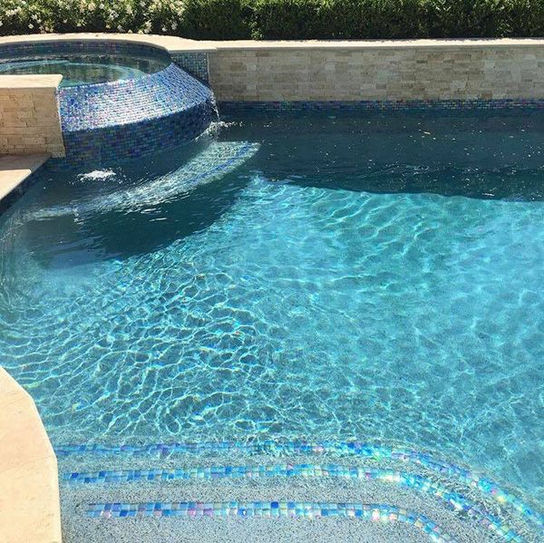 Waterline tile band and spa spillway on a Houston pool