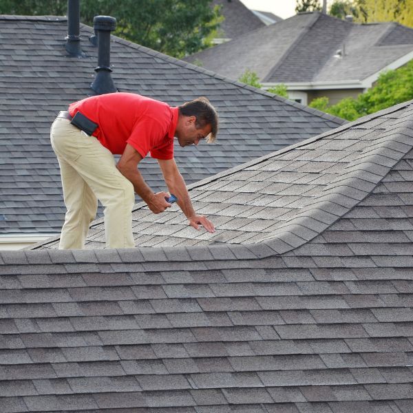 Contractor inspecting roof