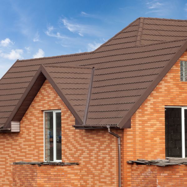 Brick home with stone-coated metal roof