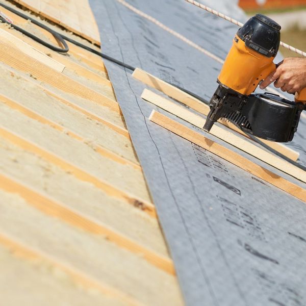 Person doing a roof installation