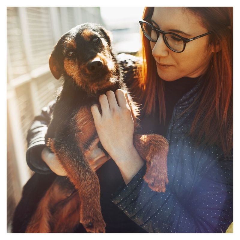 woman holding puppy