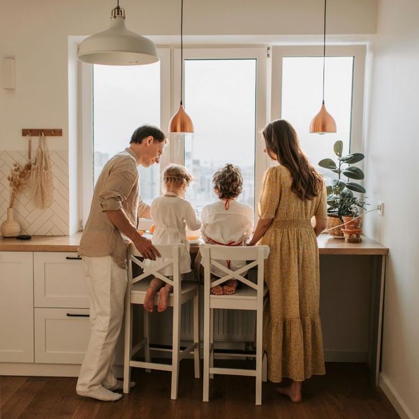 Family with kids looking at counter top