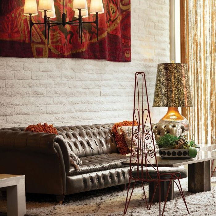 Lamp in living room with maroon and gold decor
