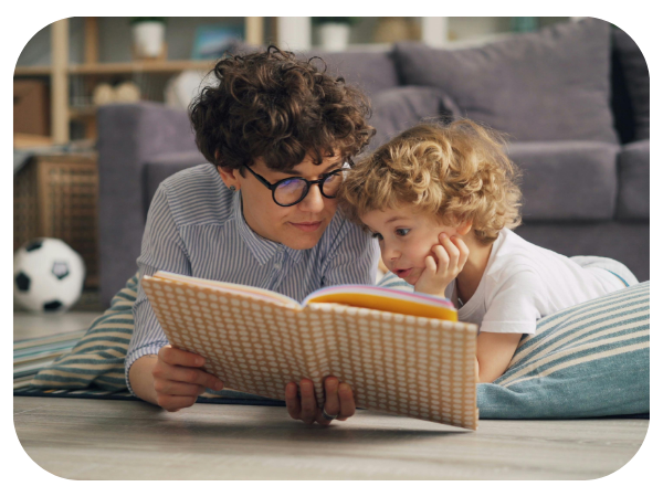 parent reading book with child 