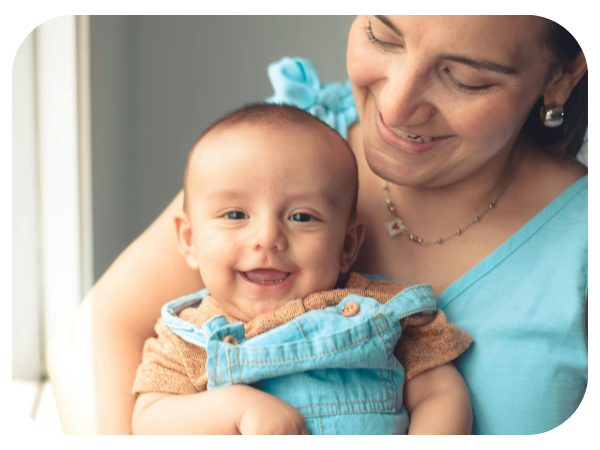 caregiver holding happy baby caregiver holding happy baby