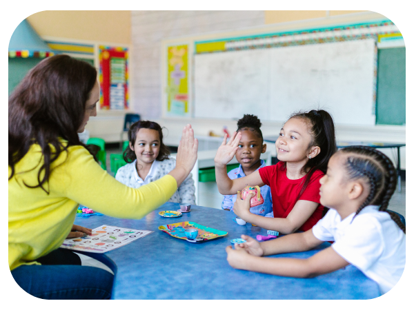 teacher high-fiving student 