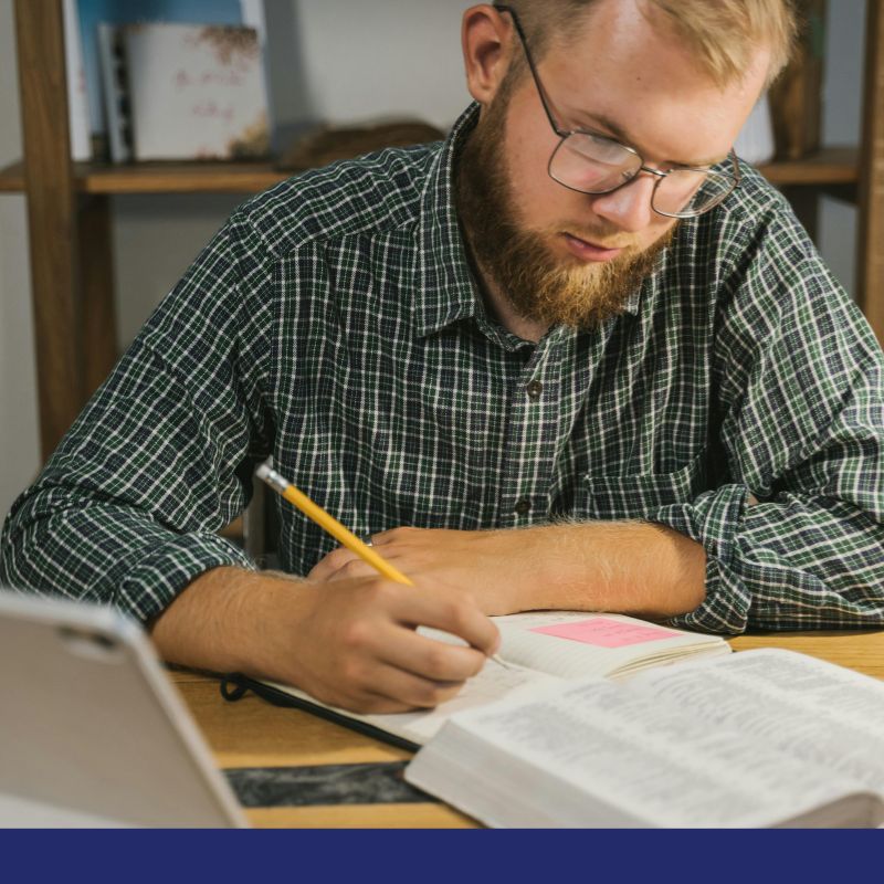man studying the bible man studying the bible