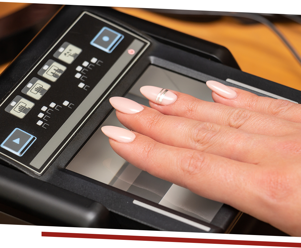 Woman's hand on fingerprint scanner
