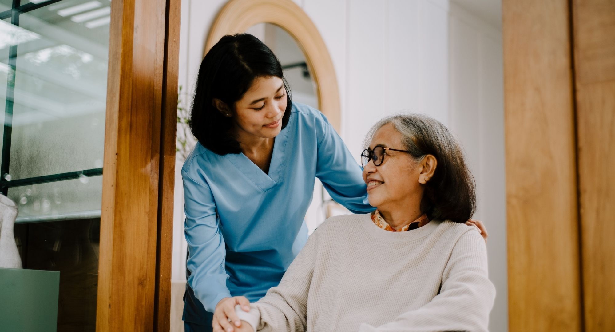 nurse helps woman in assisted living nurse helps woman in assisted living
