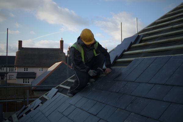roofing contractor working on a slate roof