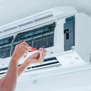 img of someone working on hvac equipment 