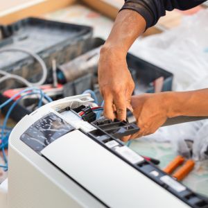 img of someone repairing hvac equipment 