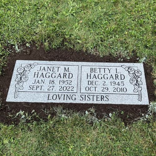 grave marker flush with ground 