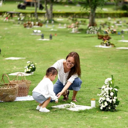 family visiting a late family member