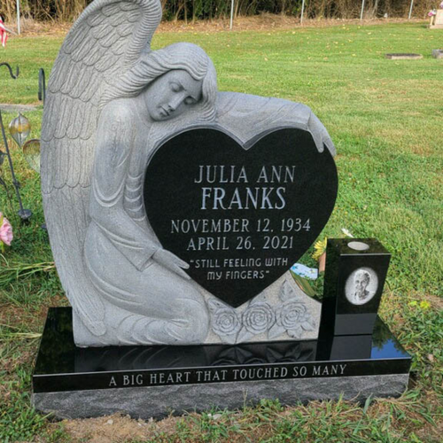 custom headstone with angel holding heart