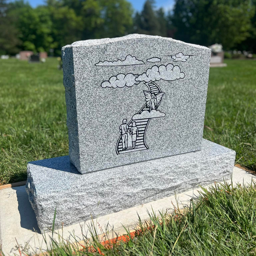 engraved headstone with imagery