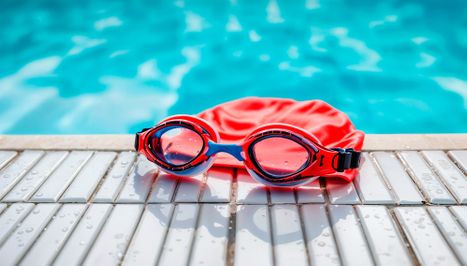 swim goggles and cap on edge of pool.jpg