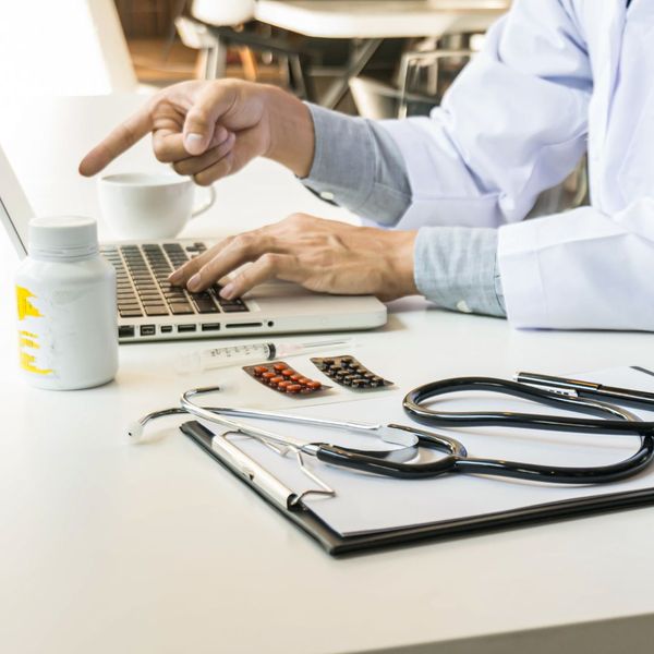 Doctor collecting documentation and medications.