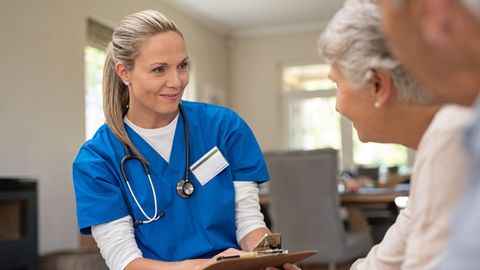 A private nurse talking to patients.