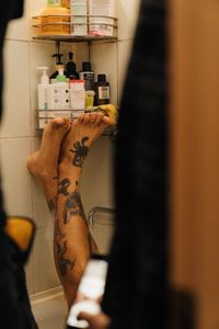 Can I Shower After Getting a Tattoo? - Sacred Raven Tattoo