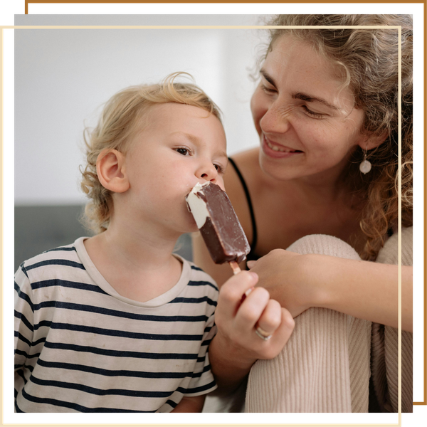 Son eating an ice cream bar