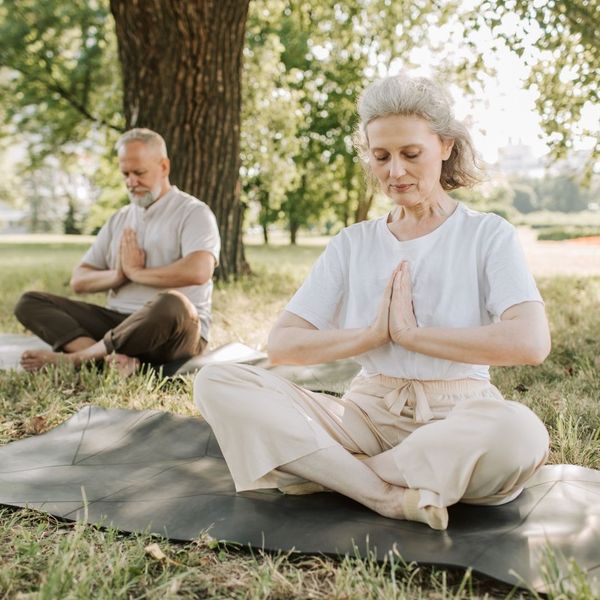 an older couple doing yoga