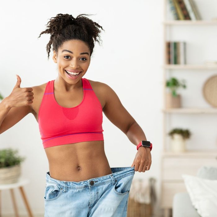 happy woman in big pants