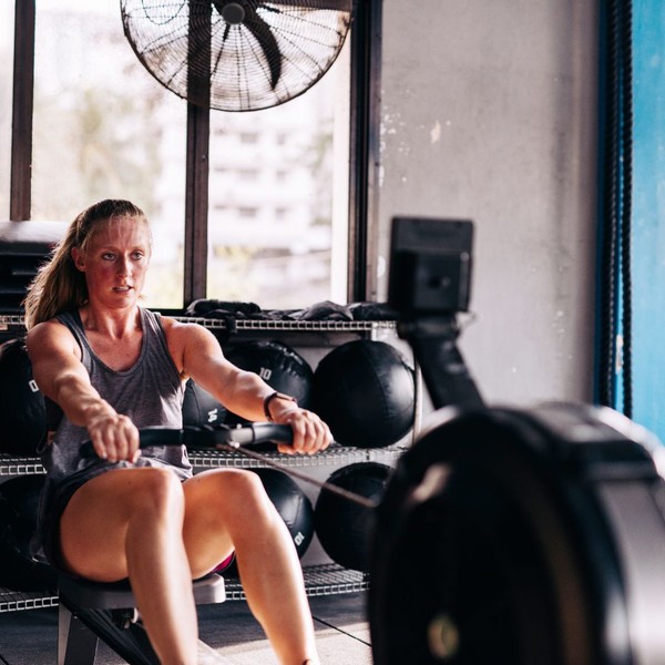 a woman working out on a rowing machine