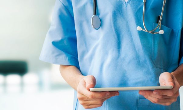 nurse holding tablet