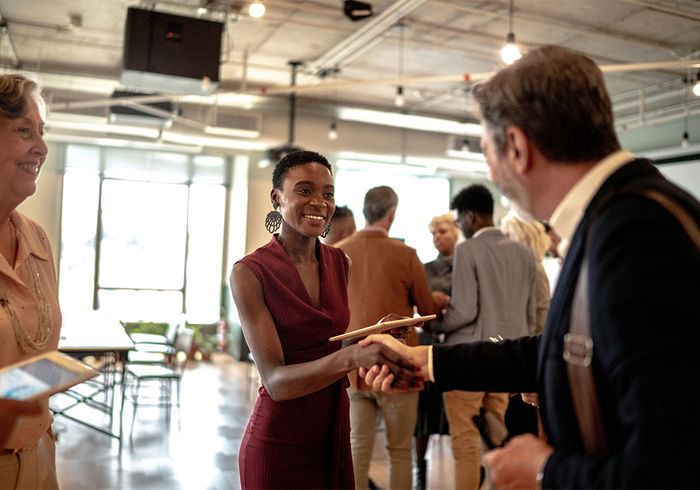 group of people networking at event