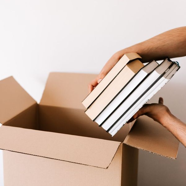 placing books into a box