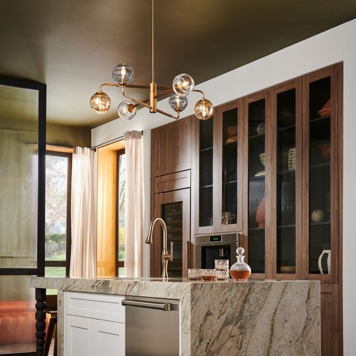 bronze chandelier in room with fall colors