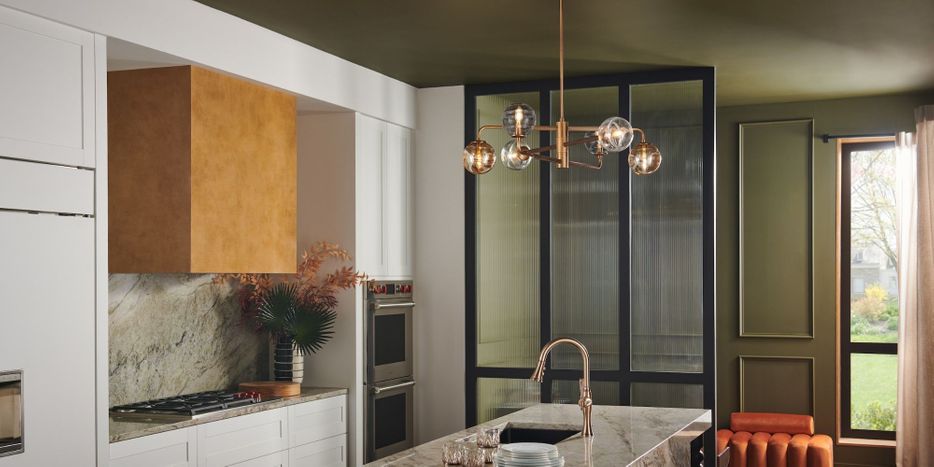 bronze chandelier in room with fall colors