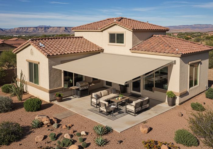 An elegant home with a retractable patio awning and an outdoor living area in Southern Utah retractable electric awning