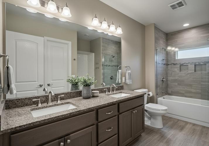 Double Vanity and Tiled Shower in Modern Bathroom