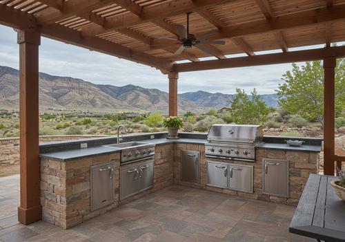 Custom outdoor kitchen with stone base, stainless grill, and wood pergola in Santa Clara, Utah. Custom outdoor kitchen with stone base, stainless grill, and wood pergola in Santa Clara, Utah.