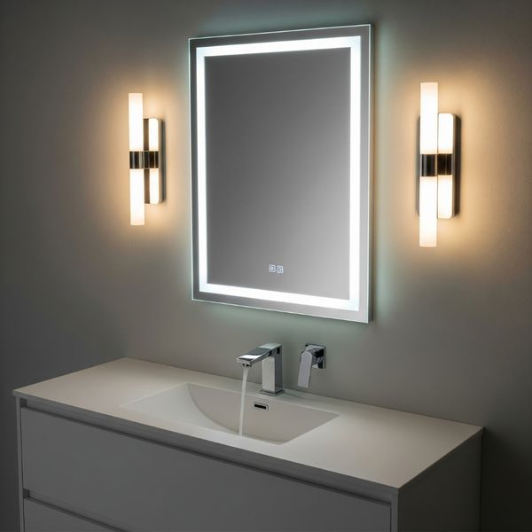 A modern bathroom vanity with sophisticated layered lighting and a smart, backlit mirror. A modern bathroom vanity with sophisticated layered lighting and a smart, backlit mirror.