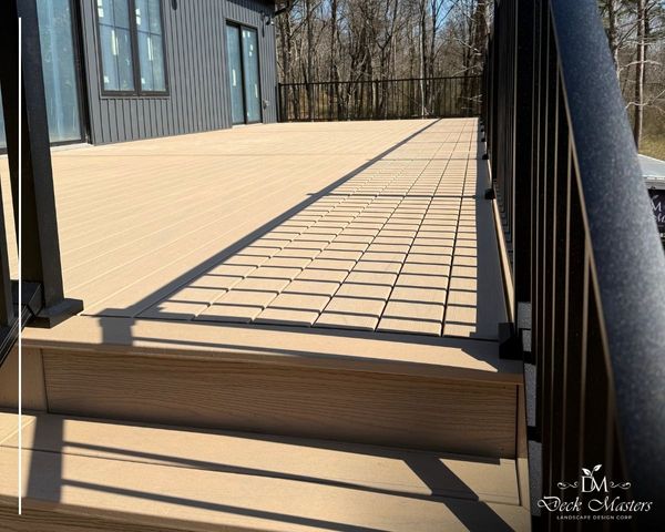 low long view of new deck, railing shadows