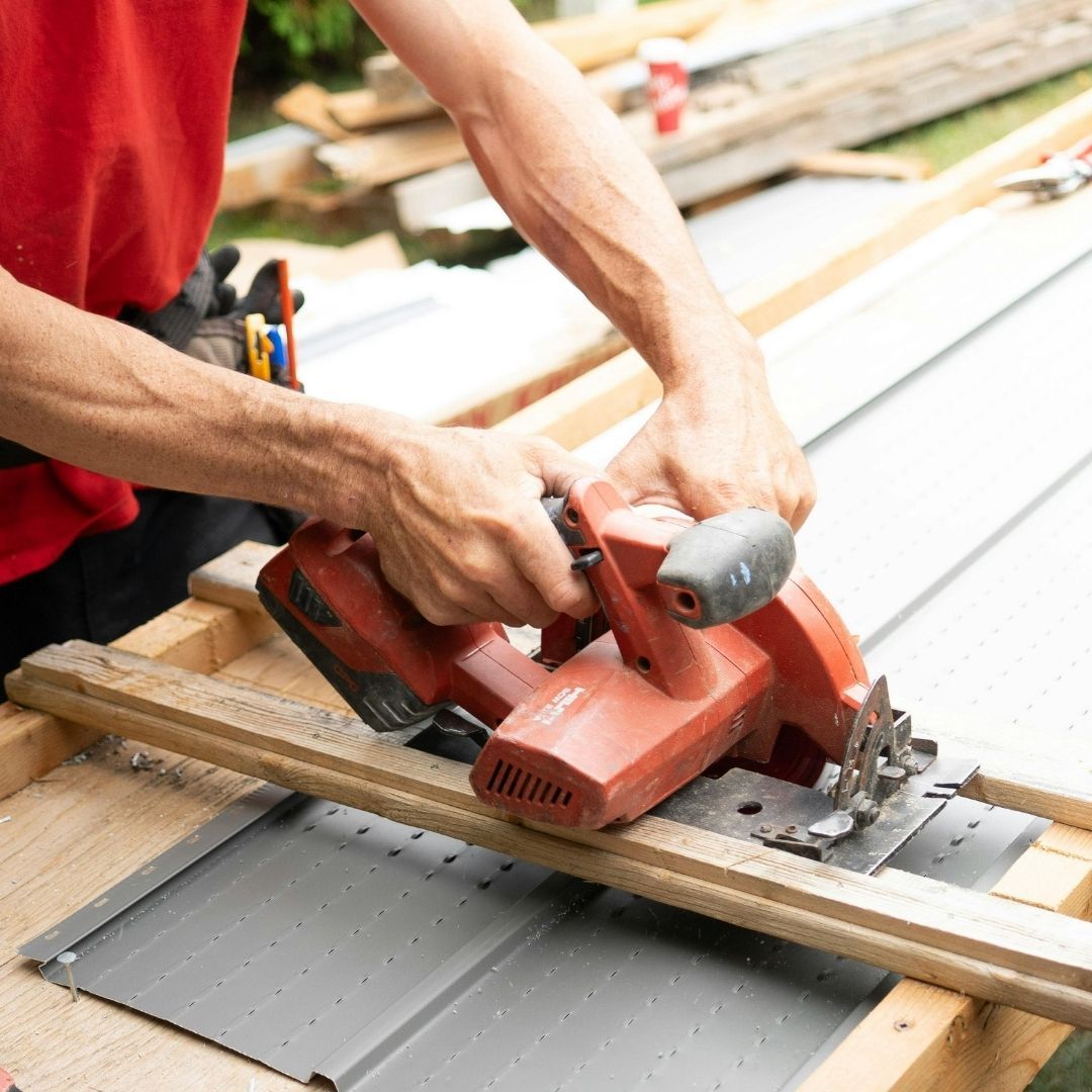 A carpenter cutting wood