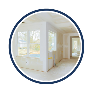 A room in a home with newly drywalled walls