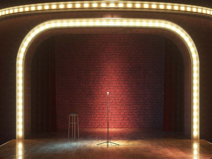 A stage with fun lights and red brick