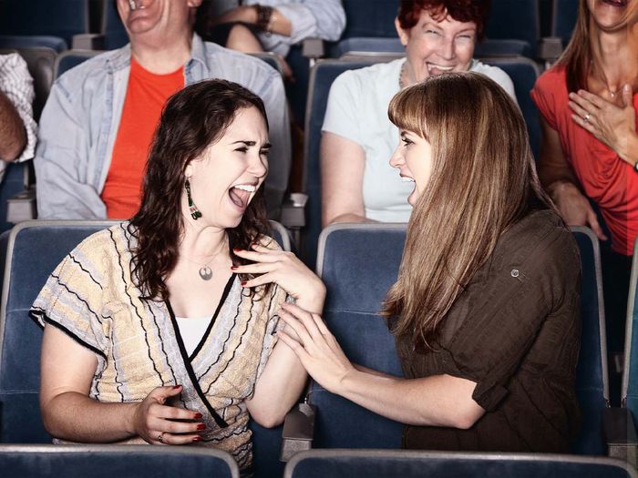 2 girls bursting with laughter