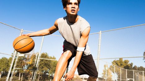 Young man dribbling basketball