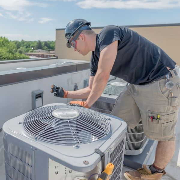 HVAC technician changing a filter