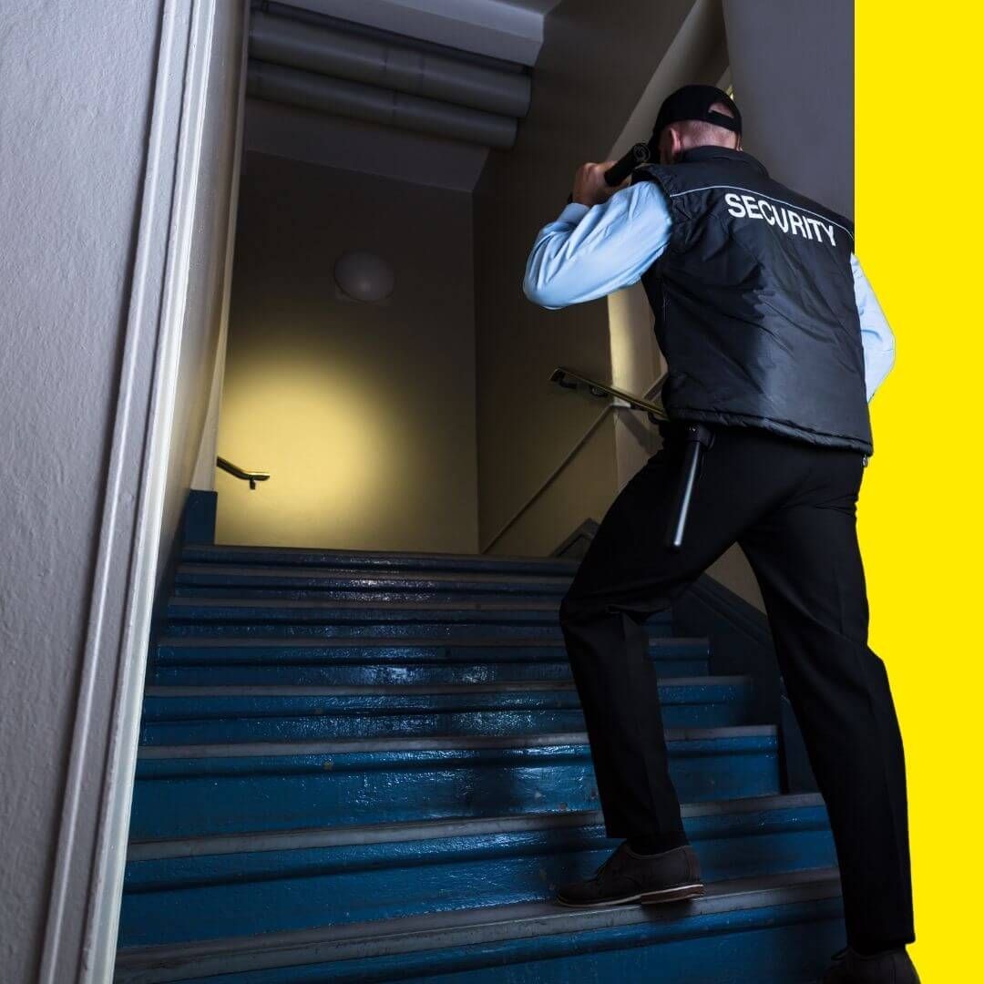 security guard walking up stairs