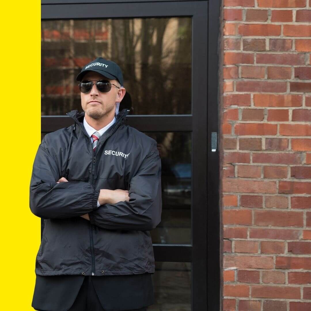 security guard standing at business door