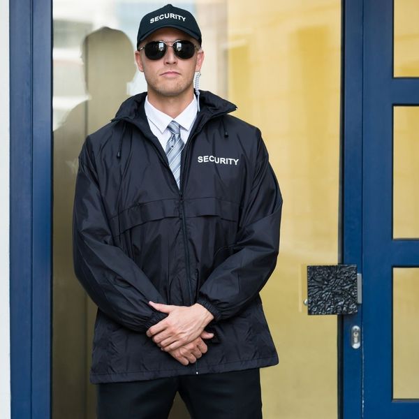 Guard standing at a door