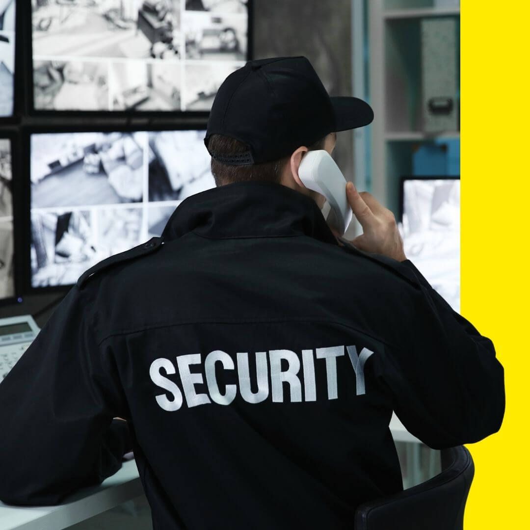 security guard watching cameras