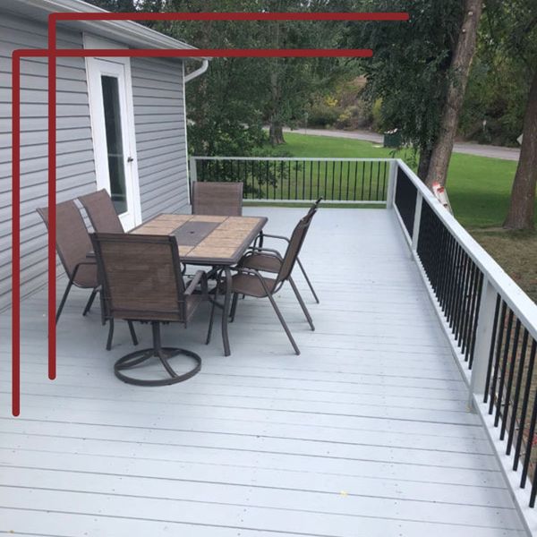 deck with a table and chairs